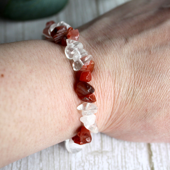 Close up of natural carnelian and clear quartz crystal chips in handmade stretch bracelet
