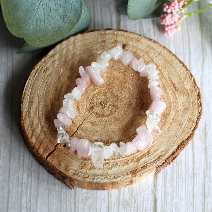 Rose quartz and clear quartz stretch bracelet with natural pink and clear gemstone chips on white background