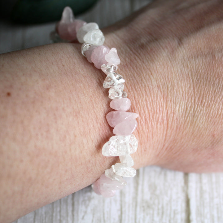 Close up of natural rose quartz and clear quartz crystal chips in handmade stretch bracelet