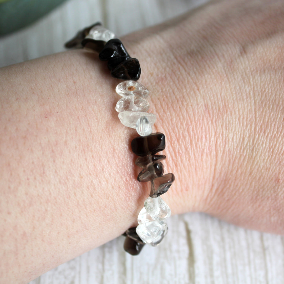 Close up of natural smoky quartz and clear quartz crystal chips in handmade stretch bracelet