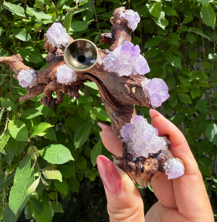 Natural branch driftwood amethyst incense holder and crystal sphere stand with purple amethyst clusters along full length