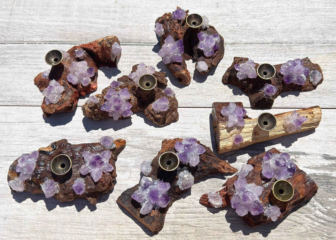 Natural amethyst driftwood incense holders and crystal sphere stands showing variety of unique shapes and amethyst clusters