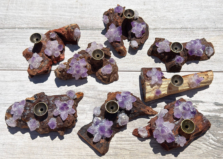 Natural amethyst driftwood incense holders and crystal sphere stands showing variety of unique shapes and amethyst clusters