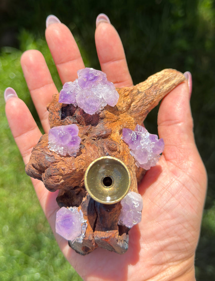 Natural driftwood amethyst crystal sphere stand and incense holder held in hand showing brass cup and amethyst clusters on all sides