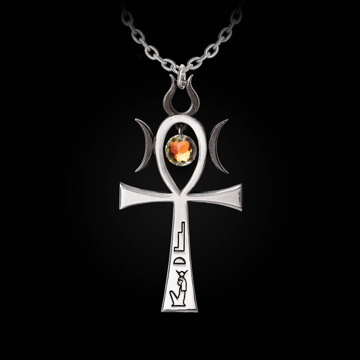 Close-up of Ankh pendant showing hieroglyphic inscriptions, Ra sun god symbols, and suspended Austrian crystal