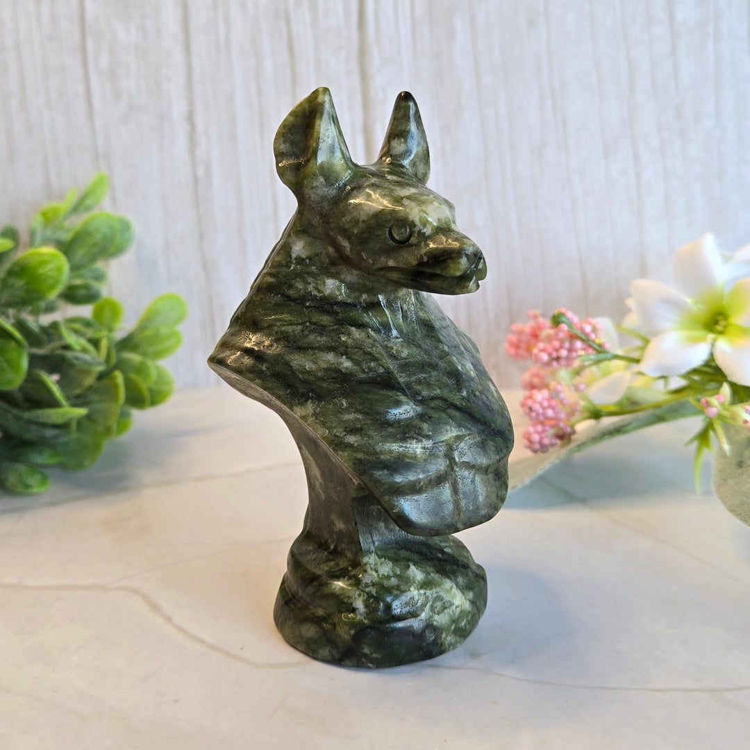 Side profile of Anubis serpentine bust showing detailed jackal head carving and Egyptian styling