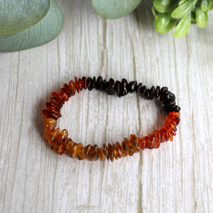 Multi-colored Baltic amber chip bracelet with honey, cognac and golden yellow gemstones on stretch elastic