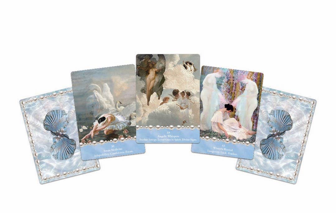 Five Cosmic Pearl Oracle cards fanned out showing celestial angelic artwork with pearl borders