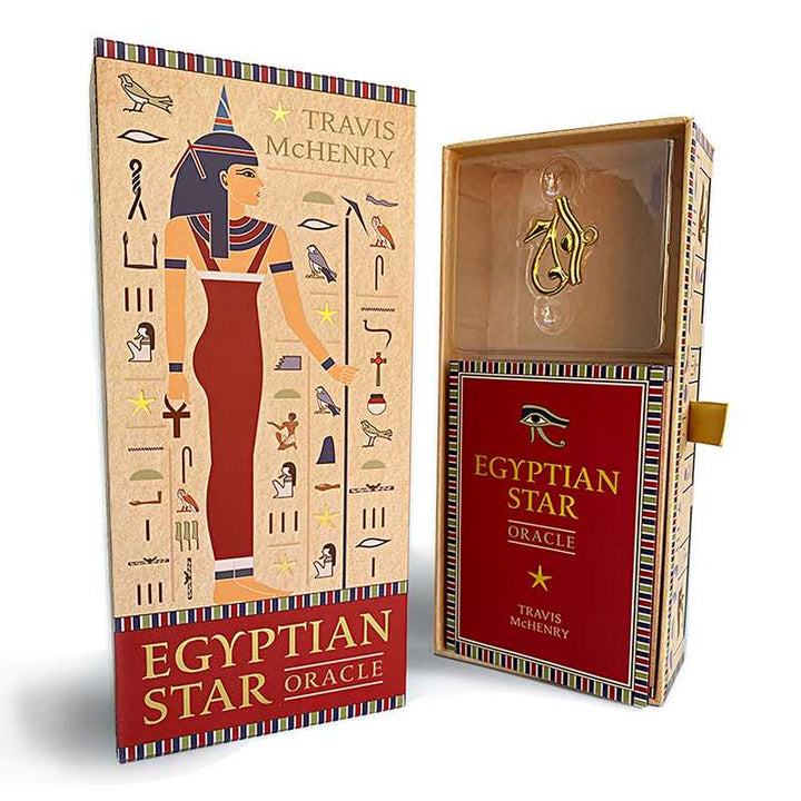 Egyptian Star Oracle deck sarcophagus-shaped box with ancient Egyptian artwork and gilded details by Travis McHenry and Eye of Horus Charm