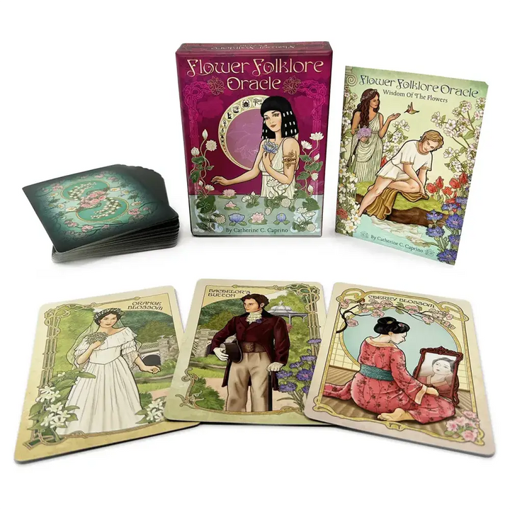 Flower Folklore Oracle 44 cards fanned showing Art Nouveau botanical card backs with teal floral border design, box, and guidebook
