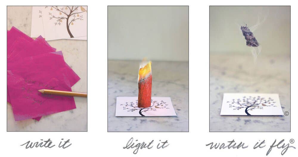 Lighting Flying Wish Paper® Aurora intention paper on platform before it flies