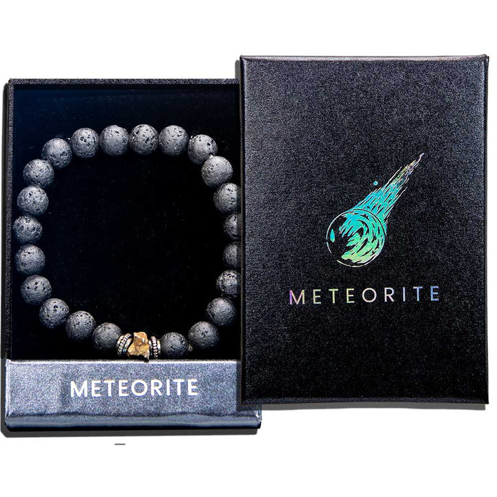 Genuine meteorite lava stone bracelet displayed in open black gift box beside closed meteorite-branded box