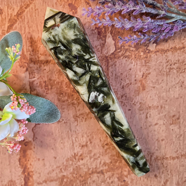 Green mica and quartz crystal wand point, side profile showing dark green inclusions and polished facets