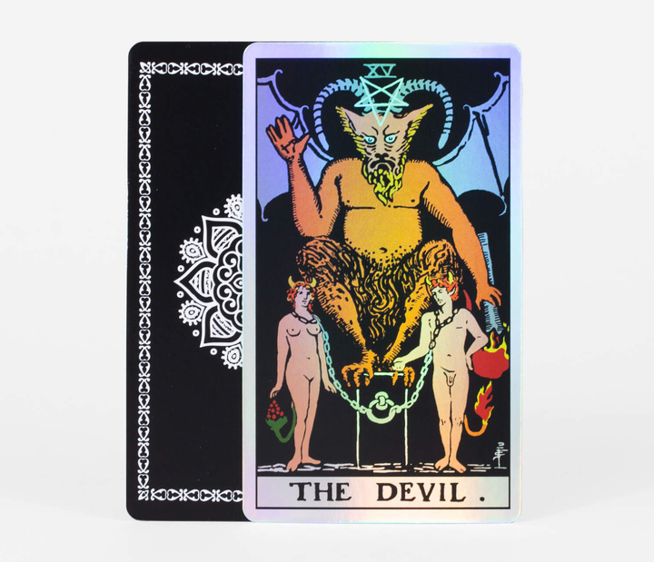The Devil Major Arcana holographic tarot card from Holo Tarot showing iridescent shimmer on black background with mandala card back
