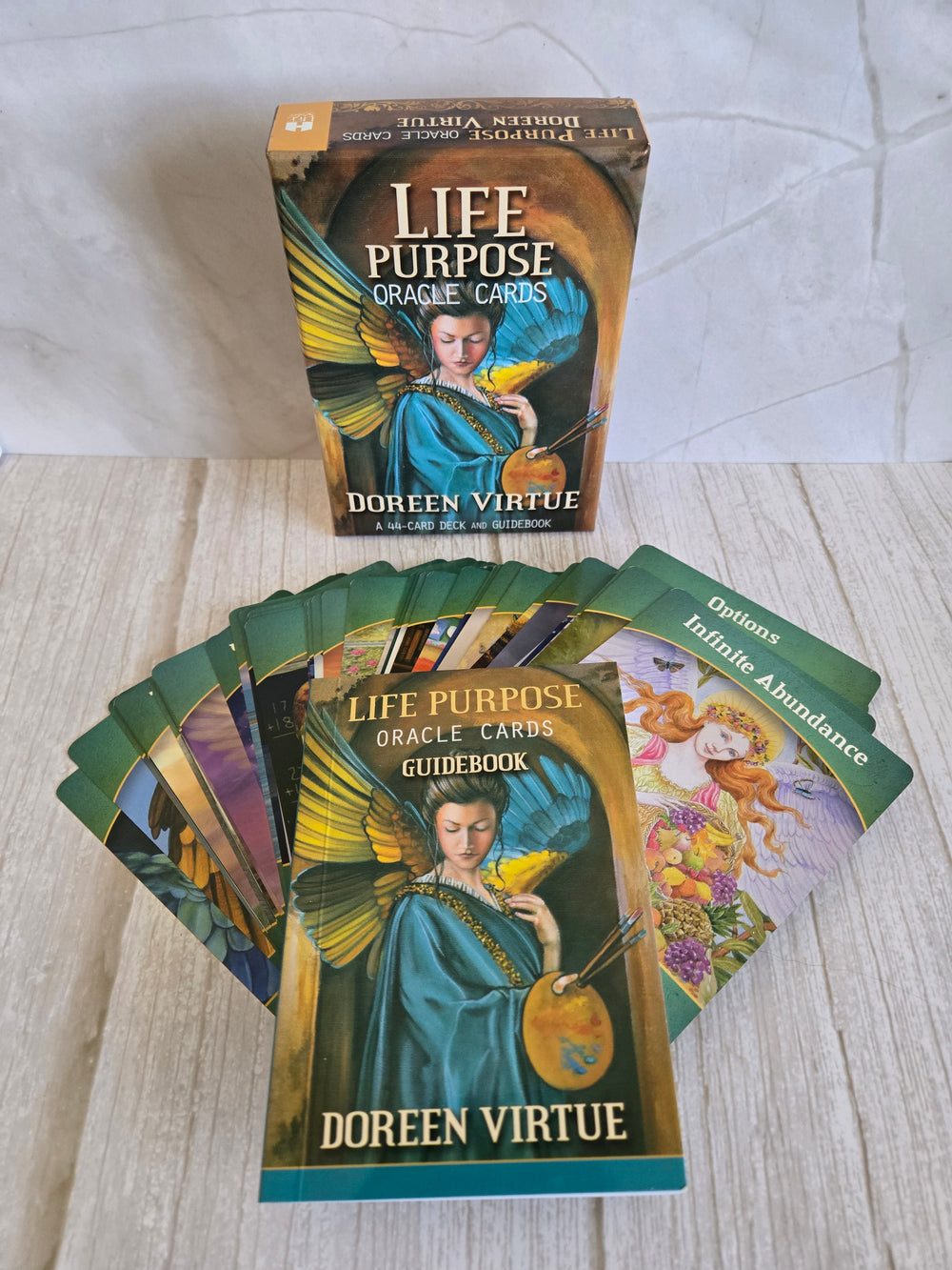 Life Purpose Oracle Cards by Doreen Virtue showing multiple cards with angelic illustrations