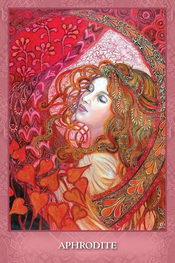 Aphrodite card from Mystic Sisters Oracle, featuring a red-haired woman surrounded by flowing red and pink patterns and heart-shaped leaves.
