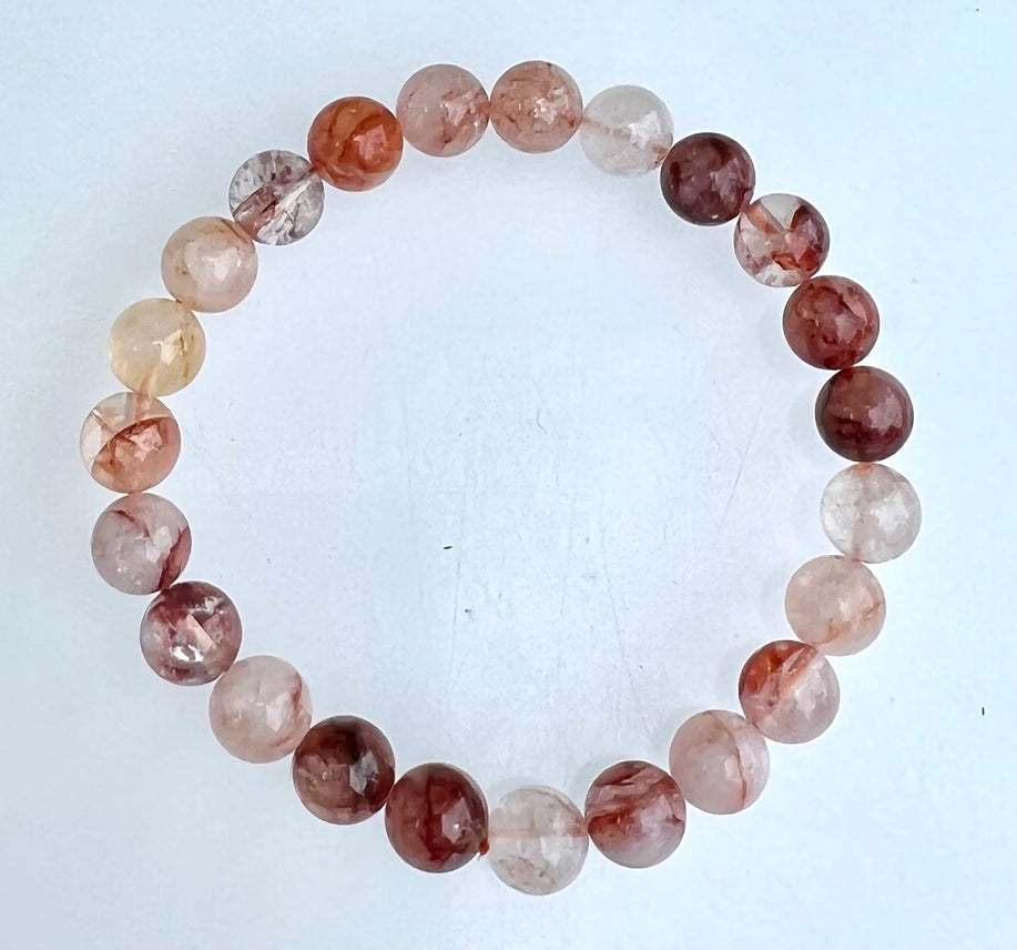 Natural Hematoid Fire Quartz 8mm crystal stretch bracelet on white background showing full bead detail
