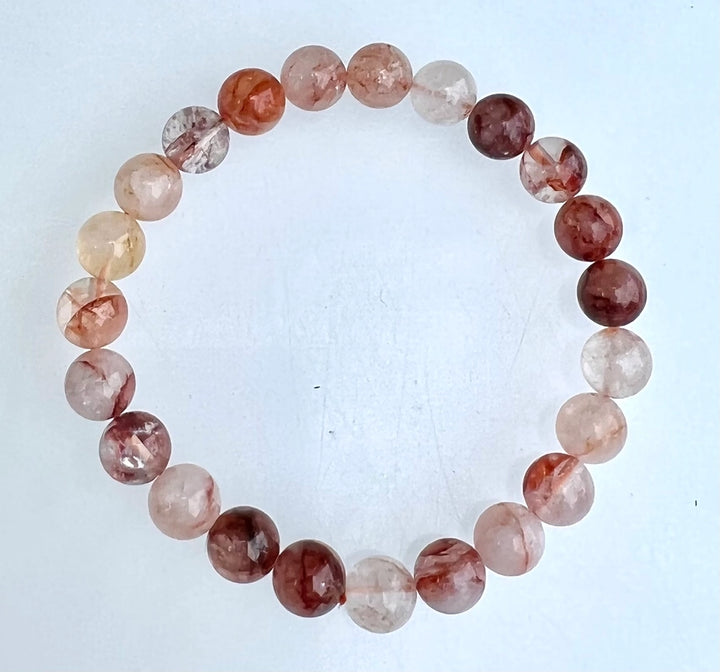 Natural Hematoid Fire Quartz 8mm crystal stretch bracelet on white background showing full bead detail