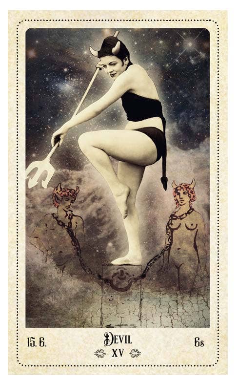 The Relative Tarot — Devil XV card featuring a vintage photograph of a woman with devil horns and trident standing over two chained figures against a cosmic sky