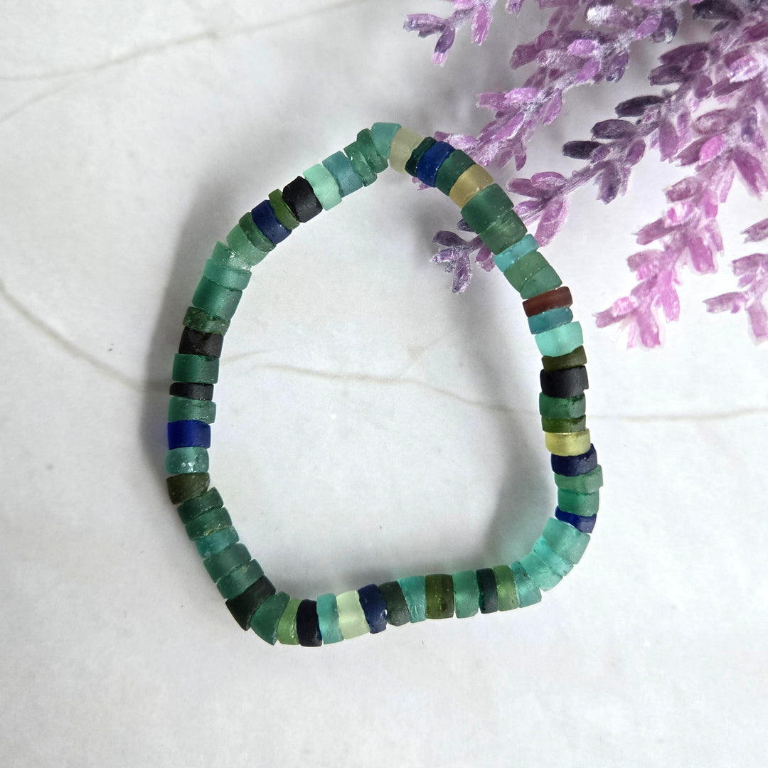 Ancient Roman glass bead stretch bracelet with authentic 2,000-year-old glass beads in natural green and blue hues