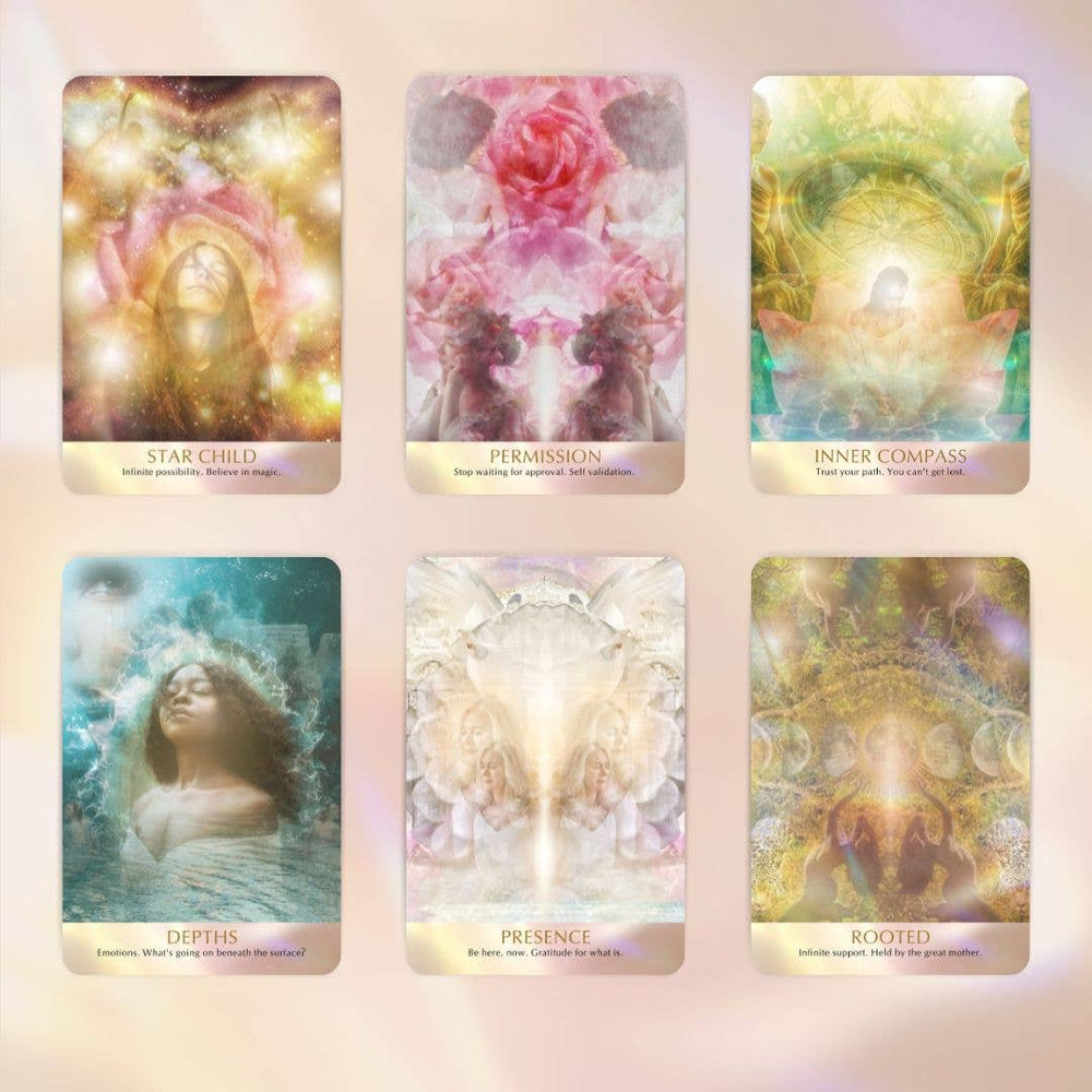 Seeds of Light Oracle cards fanned out showing spiritual and quantum-inspired artwork