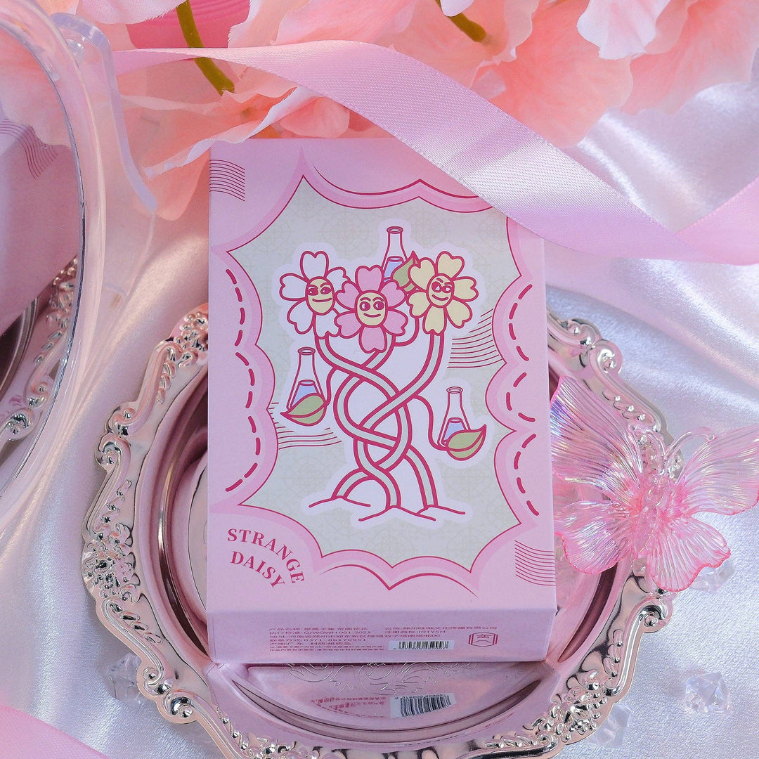 Strange Daisy Tarot deck rigid box with whimsical pink and blue kawaii daisy character design