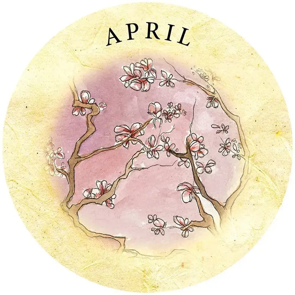 Round April card from Tea Leaf Fortune Cards, showing delicate flowering branches against a soft pink center and pale yellow border.