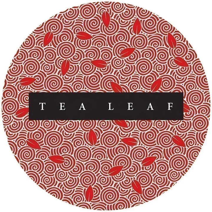 Tea Leaf Fortune Cards round card back, featuring red leaves and cream spiral patterns around a black Tea Leaf title panel.