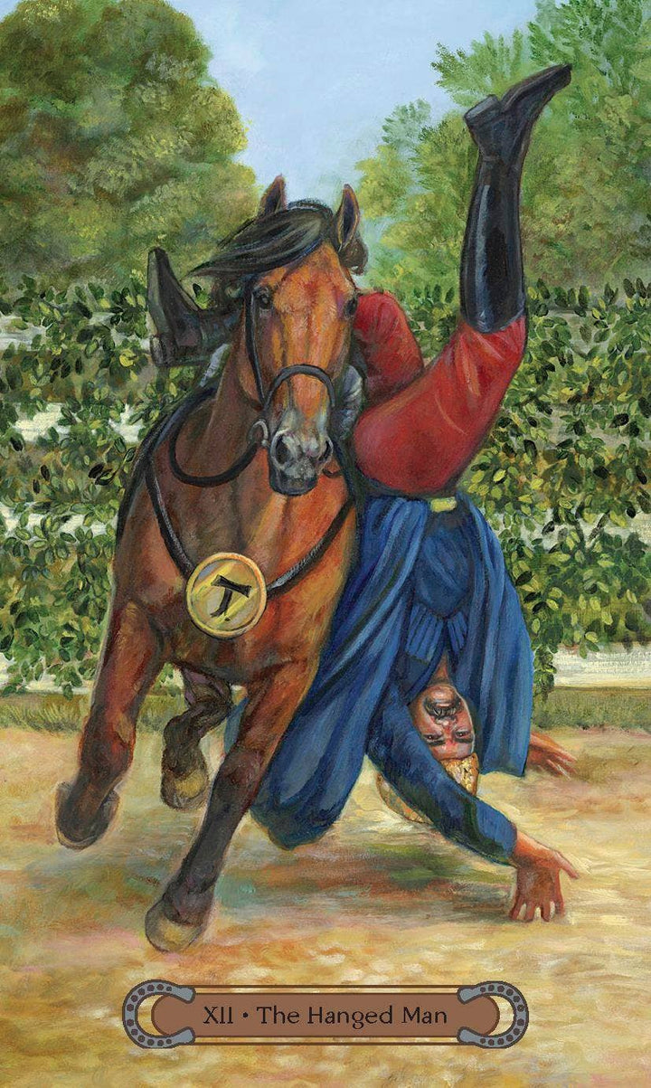 The Hanged Man tarot card (XII) from Unbridled Spirit Tarot — rider tumbling from a galloping bay horse in a lush green setting