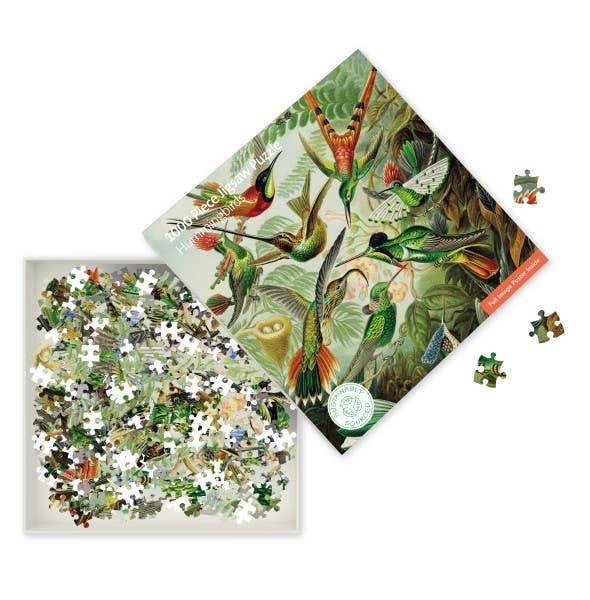 V&A Humming Birds jigsaw puzzle showing loose pieces and Ernst Haeckel hummingbird artwork detail