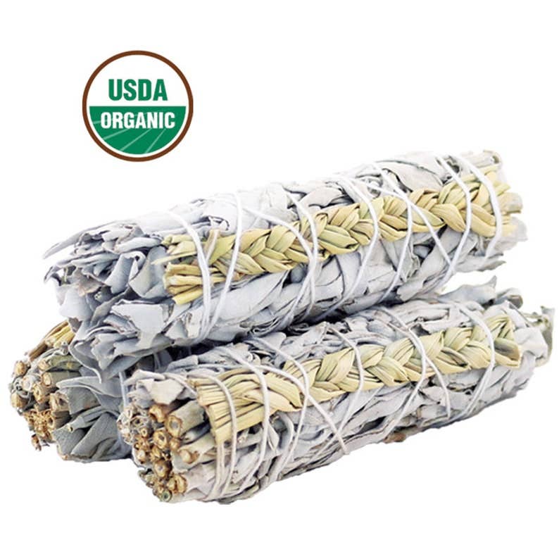 White sage bundles with braided sweetgrass tied with white string, stacked on a white background with a USDA Organic logo above