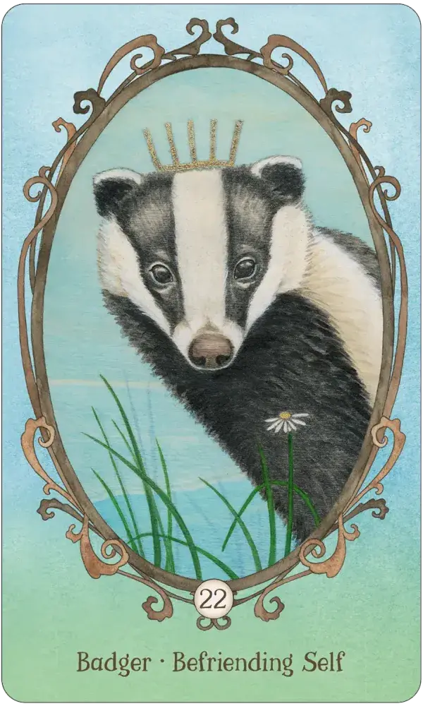 Wing Hoof and Paw Oracle Card 22 — Badger · Befriending Self, featuring a crowned badger peering forward from green grass with a single daisy in an ornate oval frame on a soft teal background