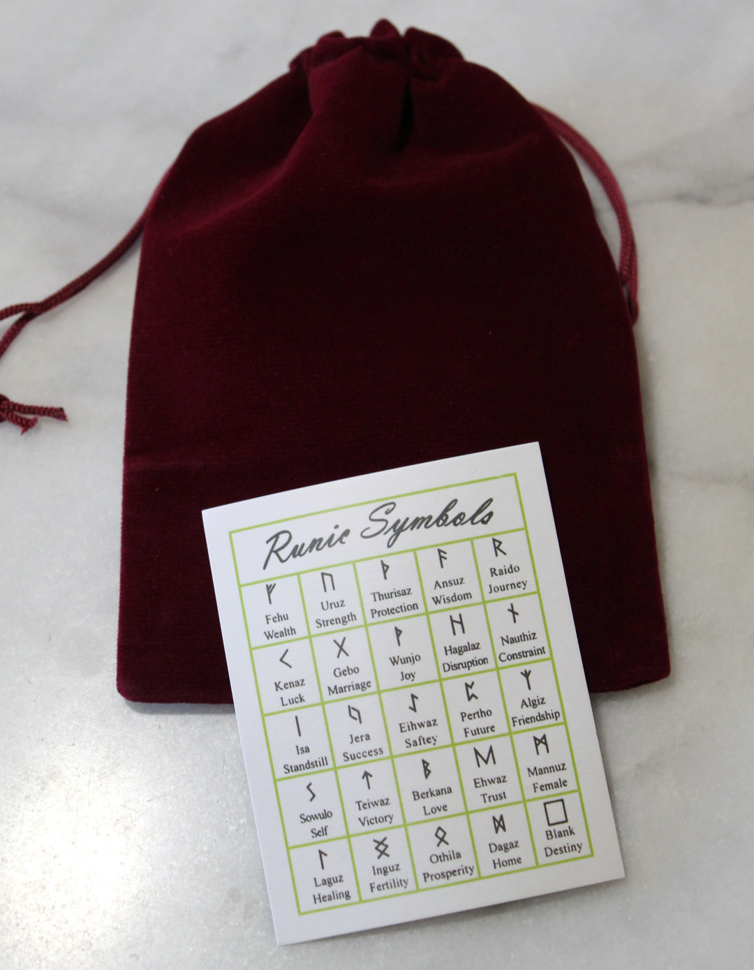 Elder Futhark symbol reference card and drawstring storage bag from the Amethyst Viking Rune Stone Set